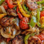 Sausage, Onion, Bell Peppers & Tomatoes Over Rice